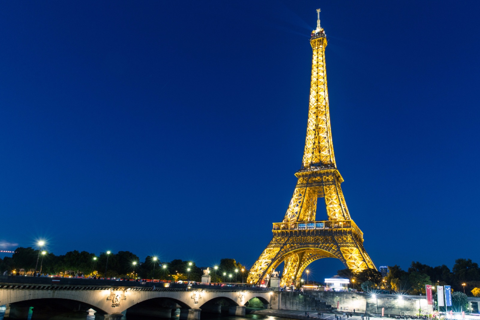 The Eiffel Tower illuminated at dusk, Paris