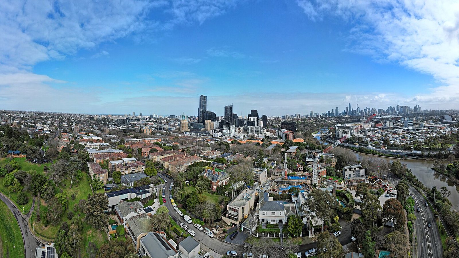 Aerial view over the houses of South Yarra towards the Melbourne city skyline and the Yarra River