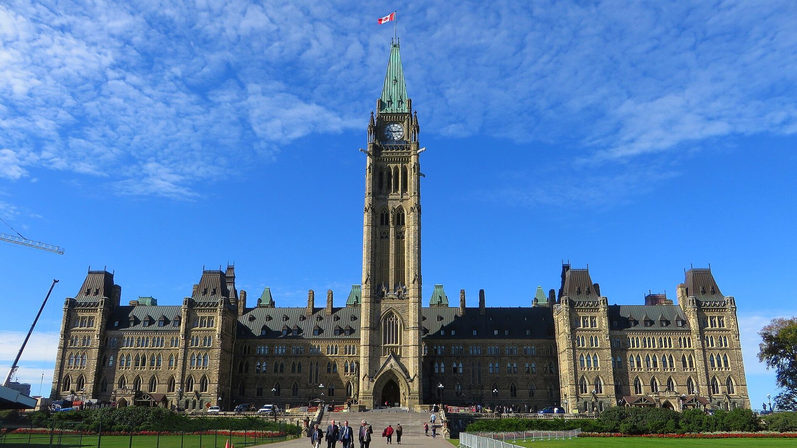 The Centre Block and Peace Tower on Parliament Hill in Ottawa under a blue sky