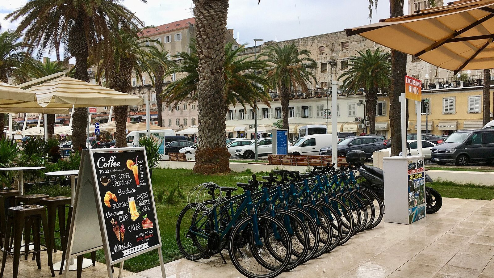 A café terrace and rental bikes on the Riva promenade in Split, Croatia