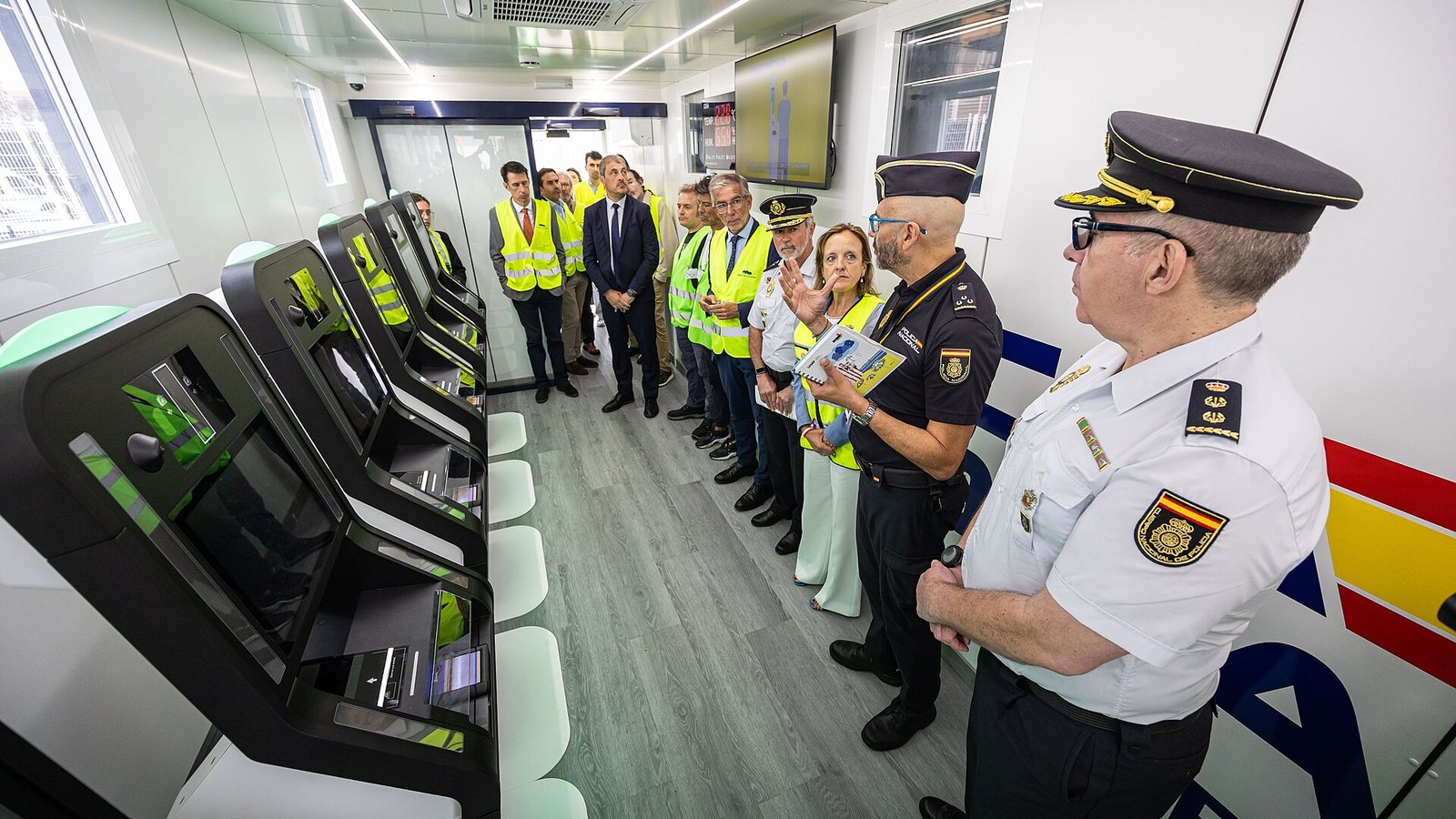Police officers and officials at a presentation of Entry/Exit System self-service kiosks at the Port of Santander, Spain