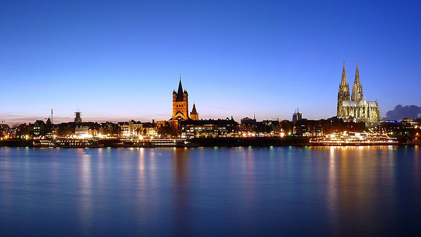 Cologne old town and cathedral seen across the Rhine at dusk