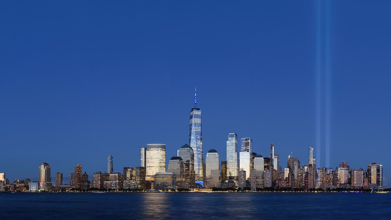 Five-segment panorama of Tribute in Light, Lower Manhattan, New York City, as viewed from Exchange Place, Jersey City, New Jersey