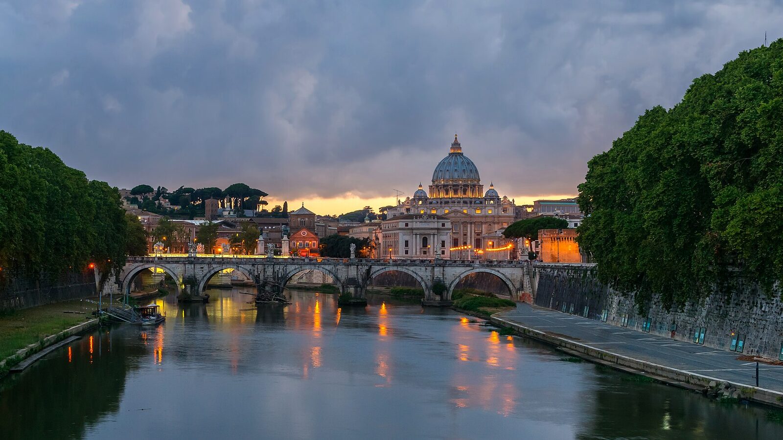 Sant'Angelo bridge and Saint Peter's Basilica at dusk, Rome, Italy