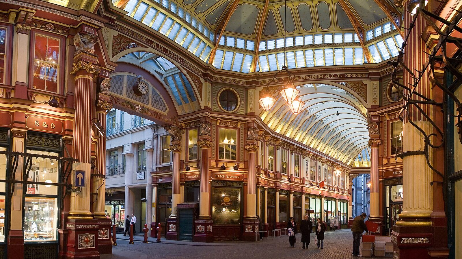 Ornate Victorian glass roof and shopfronts of Leadenhall Market in the City of London