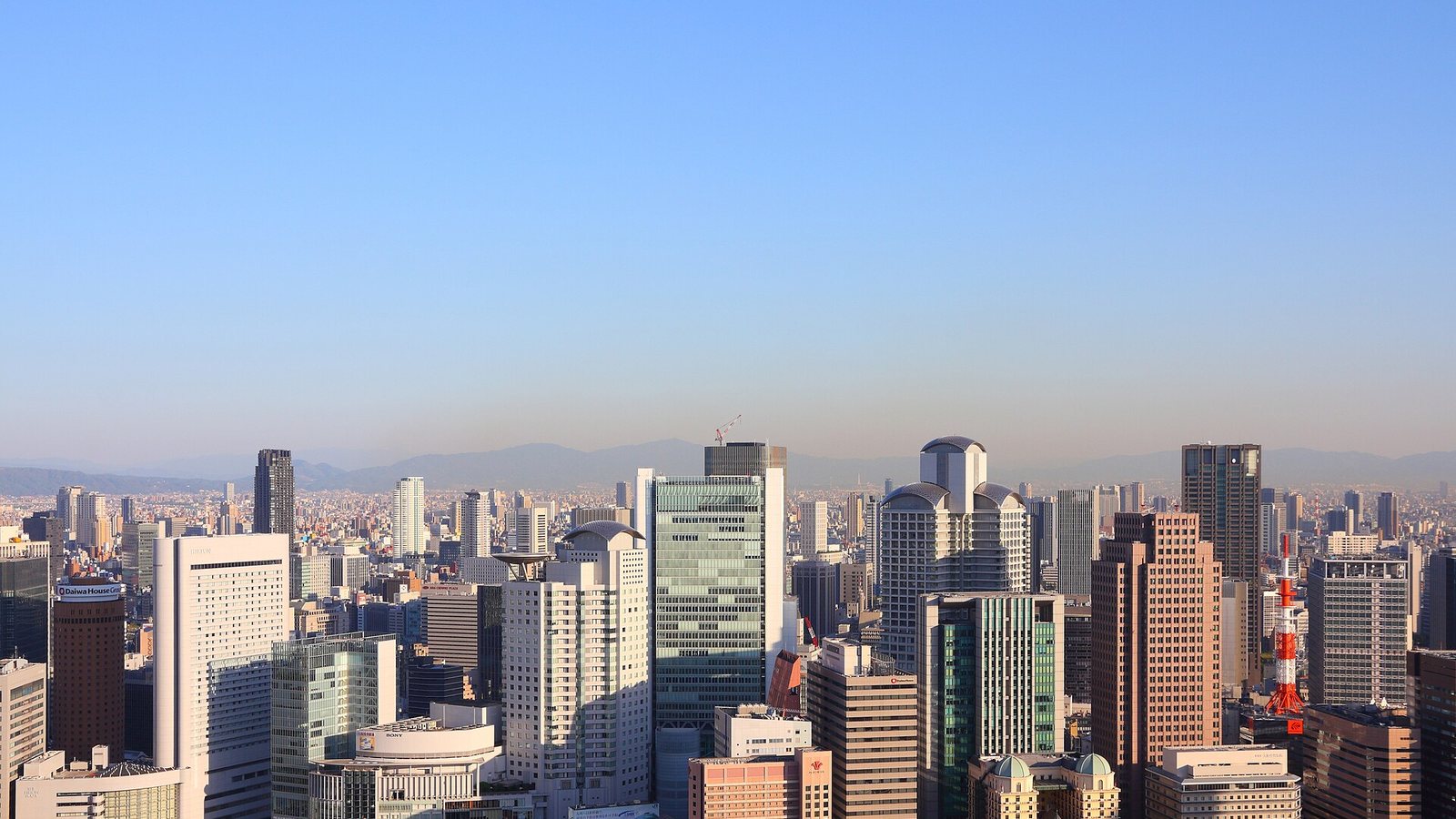 Office and hotel towers of the Umeda district in Osaka under a clear sky