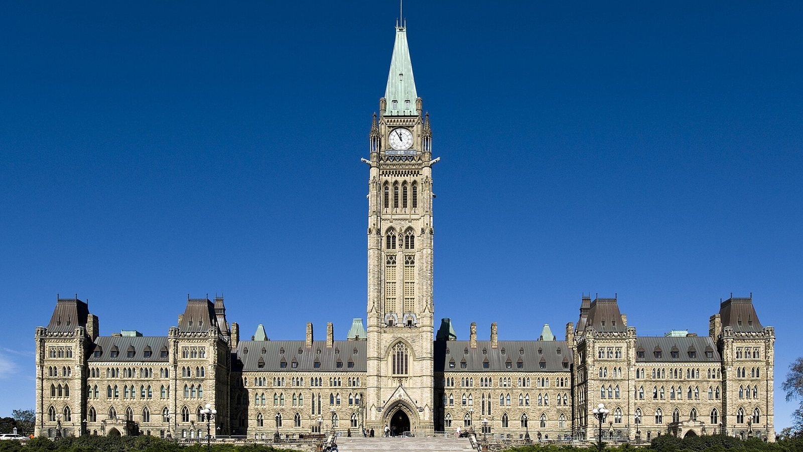 Centre Block of Canada's Parliament in Ottawa with the Peace Tower under a clear blue sky