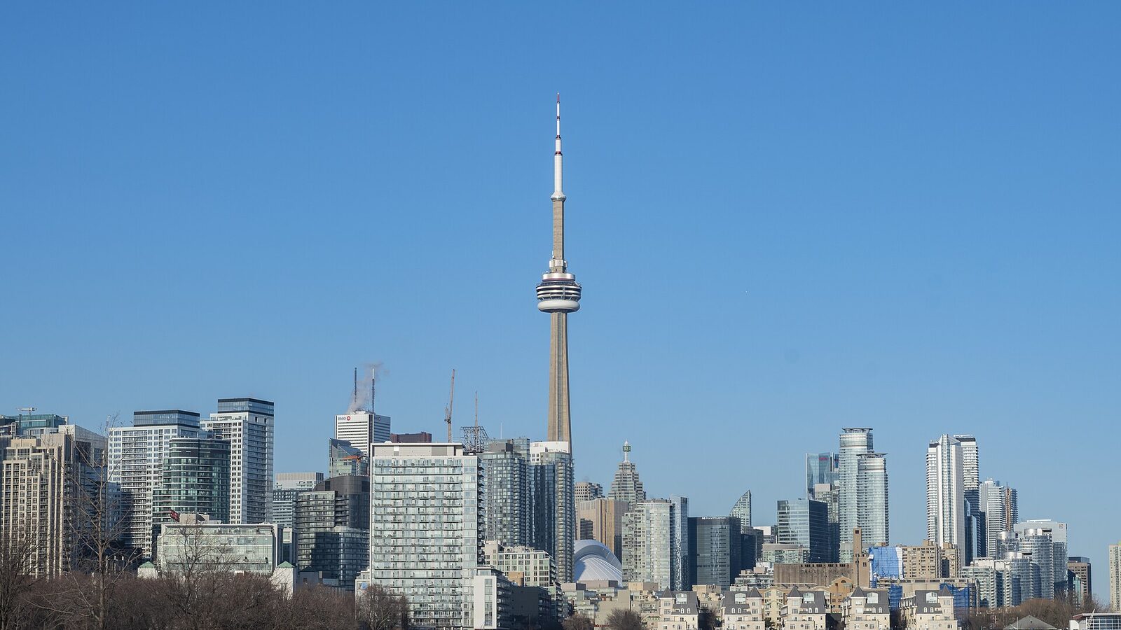Toronto skyline with the CN Tower under a clear blue sky