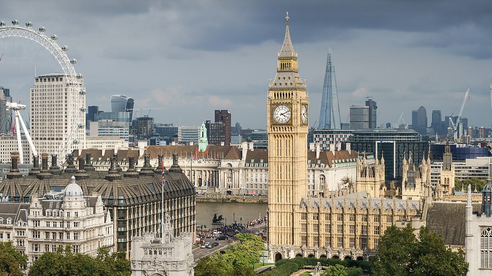 Big Ben and the Palace of Westminster with the London Eye and the Shard in the background