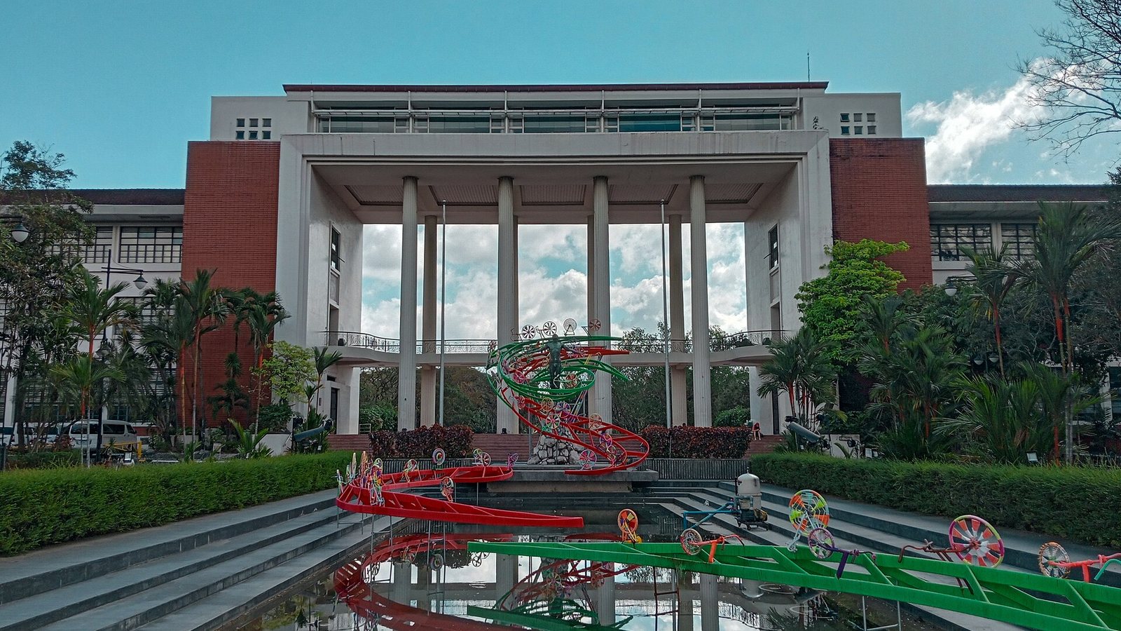 Quezon Hall at the University of the Philippines Diliman with its colonnade and reflecting pool