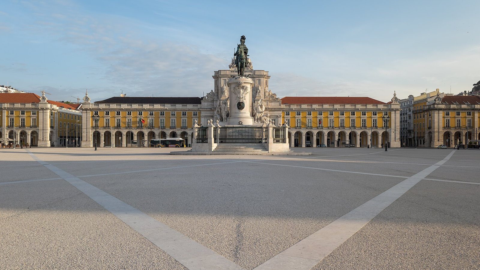 Praça do Comércio in Lisbon with the statue of King José I and yellow arcaded buildings