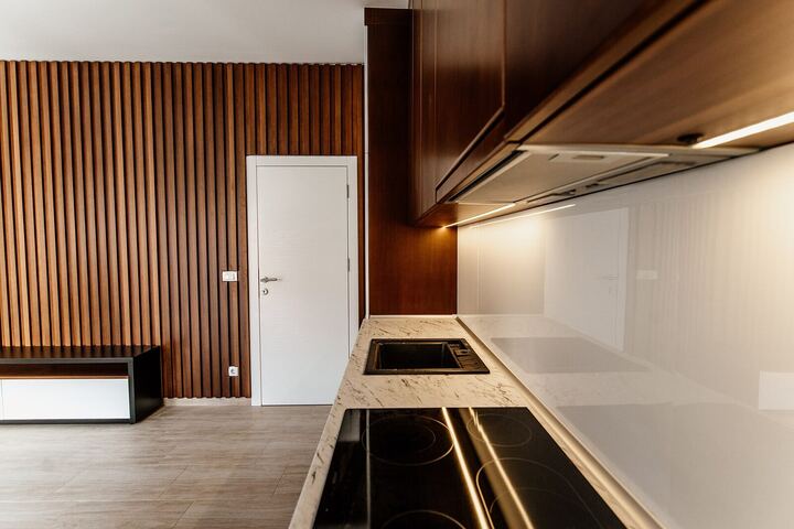 Open-plan living room with walnut kitchen